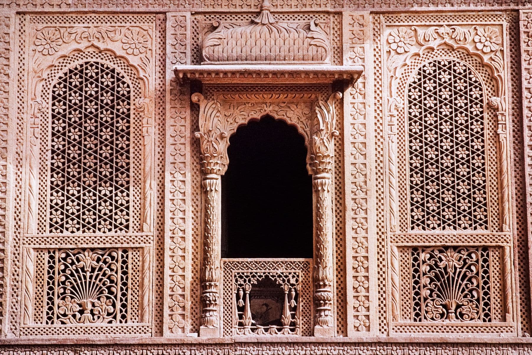 A carved sandstone doorway in an Indian building