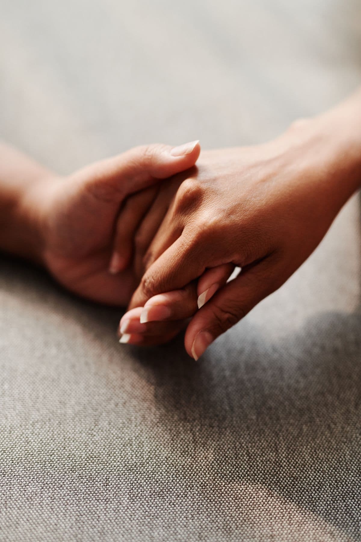 Two hands resting together